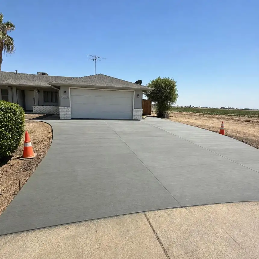 Fresh broom finish concrete driveway poured at a Madera, CA home